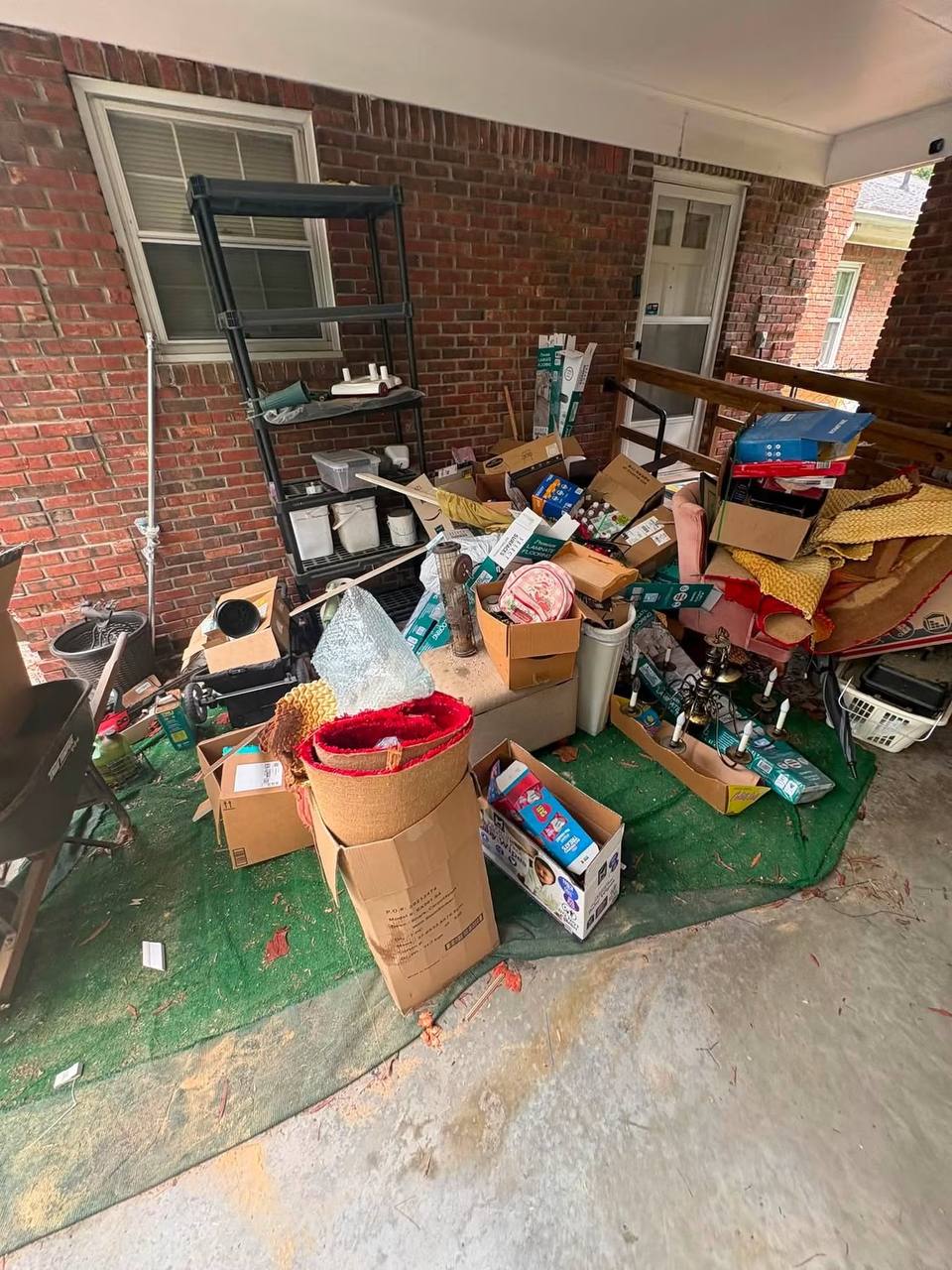 Porch packed with junk before Junk Rooster